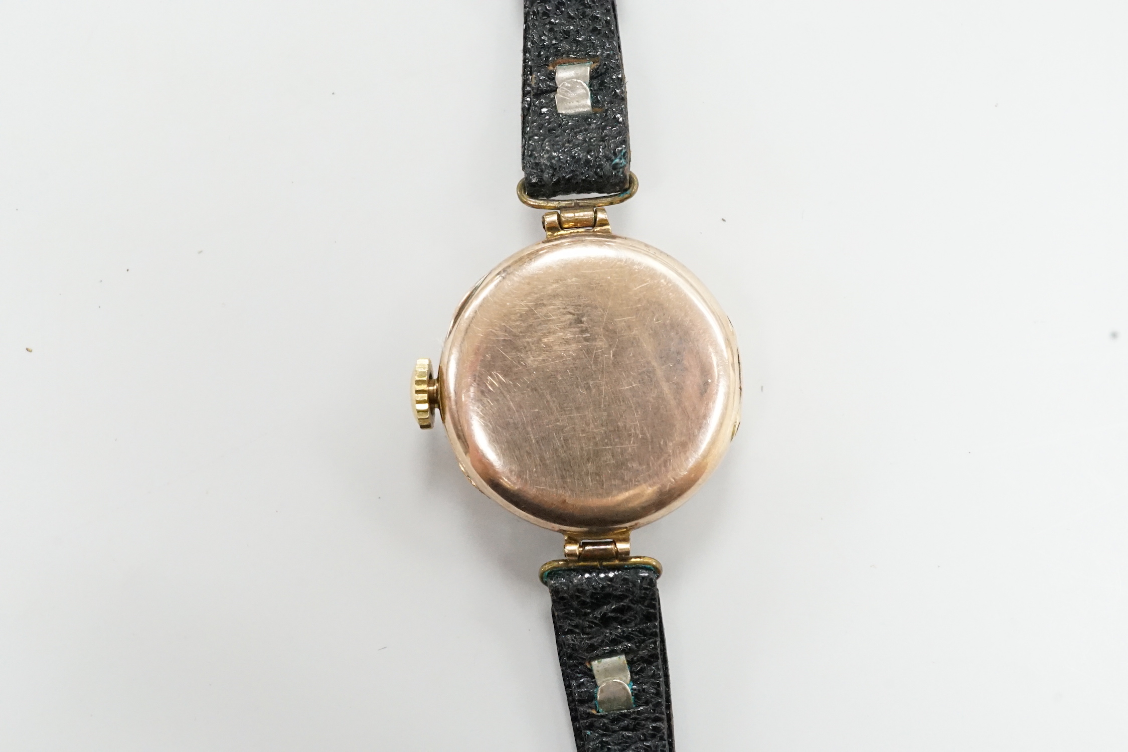 An early 20th century 9ct gold Rolex manual wind wrist watch, with Arabic dial, case diameter 27mm, on associated leather strap.